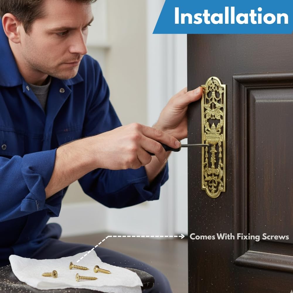 Antique solid brass finger plate installed on an internal wooden door