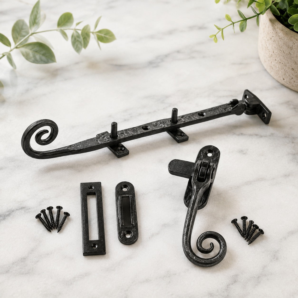 Black cast iron monkey tail window fastener with mortice and hook receivers