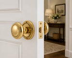 Classic Georgian brass door knobs installed on a traditional timber panel door