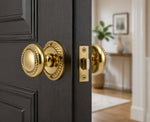 Traditional polished brass Georgian door knobs fitted in a heritage interior