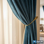 Vintage brass curtain tie backs in a traditional living room