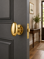 Polished brass mortice door knobs fitted in a traditional period interior